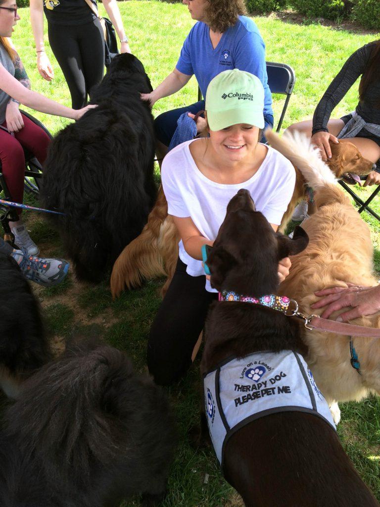 Photo by Jazmin del Angel Student Sarah Hall enjoys interacting with dogs brought to LU by Love on a Leash