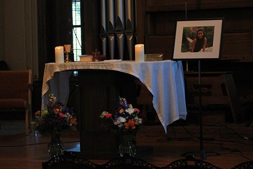 Photo by Lindsey Fiala Photo of Marianne Olyslager Maldonado is displayed at the altar during the service. 