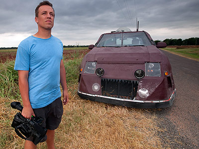 Storm Chaser Reed Timmer stands in front of the Dominator