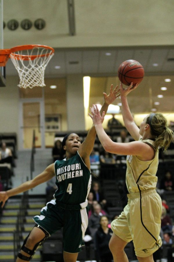 Junior Guard Morgan Johnson goes up for a shot against Missouri Southern defender during the Lions' 71-61 loss.