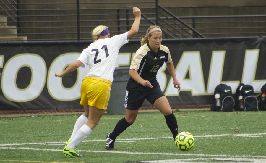 Kristin Brewer faces a MSSU defender in a game on Oct. 12.