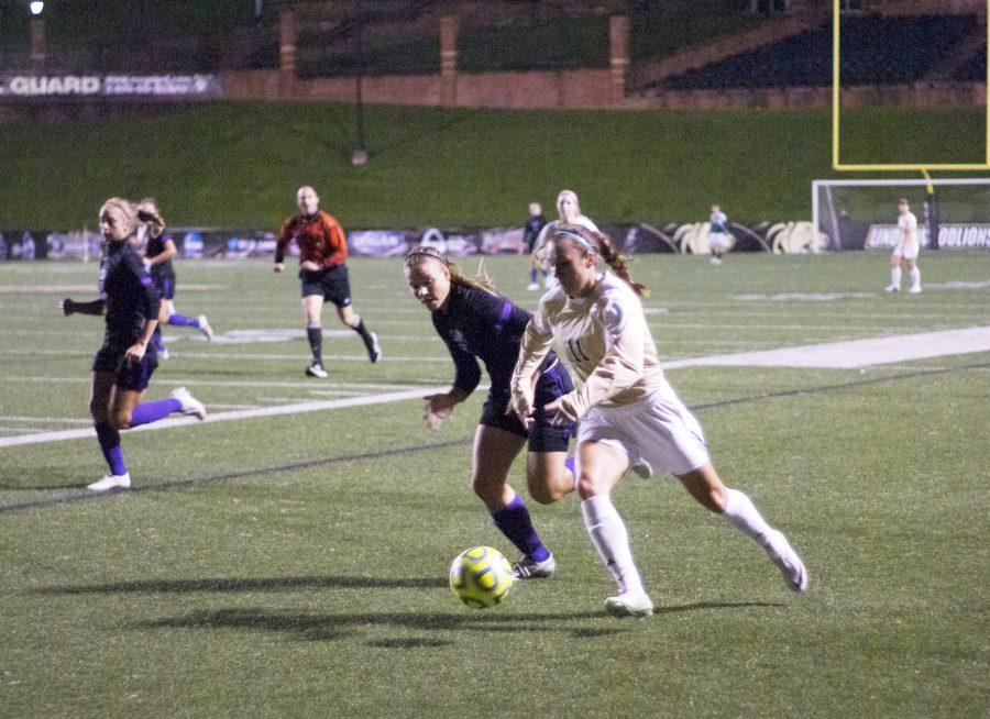 Christie Byrne (11) faces a Bearcat defender in Friday night's game.