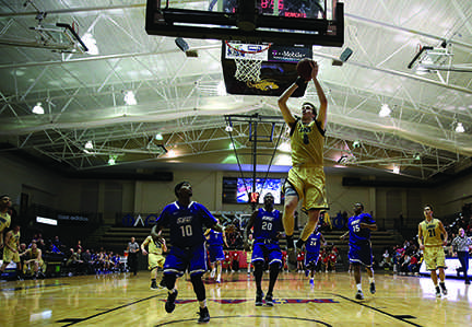 Photo by Carly Fristoe 	
Junior Sam Mader goes airborne in a game against Southwest Baptist last season.