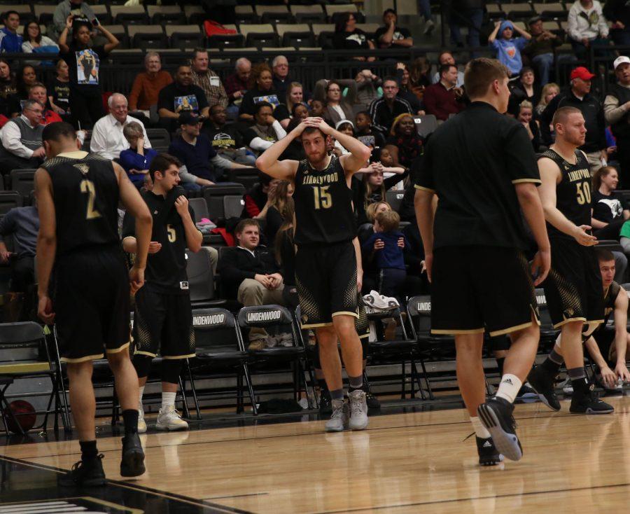 Rayko Dundalov holds his head in disbelief following the mens basketball teams 59-58 loss to UCM. 

Photo by Carly Fristoe