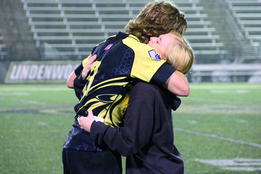 Charles+labrys+girlfriend%2C+Kiley+Ansolmo%2C+hugs+Mikey+bateman%2C+the+captain+of+the+mens+rugby+team+following+the+game.+%0A%0APhoto+courtesy+of+Sabine+neveu