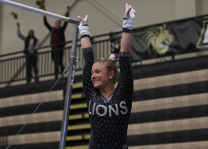 Valeri Ingui celebrates after tying LU’s top mark in the uneven parallel bars with a score of 9.825,  Photo by Carly Fristoe