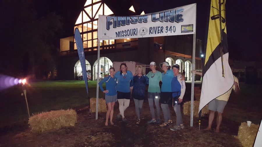 Team Boaty-licious stands at the finish line of the Missouri 340, said to be the longest non-stop river race.