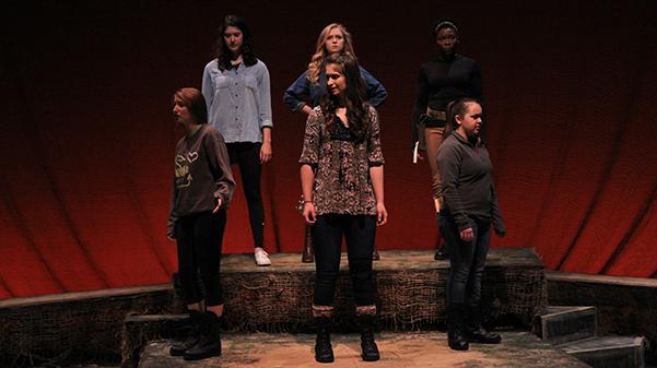 The six women of ‘A Piece of My Heart’ are on stage in the Emerson Black Box Theater during a scene in which the characters see all the injured soldiers around them.  Photo by Lindsey Fiala 
