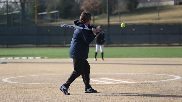 Head coach Liz Kelly winds up to take a swing during practice at Lindenwoods Lou Brock Sports Complex.  Photo by Carly Fristoe