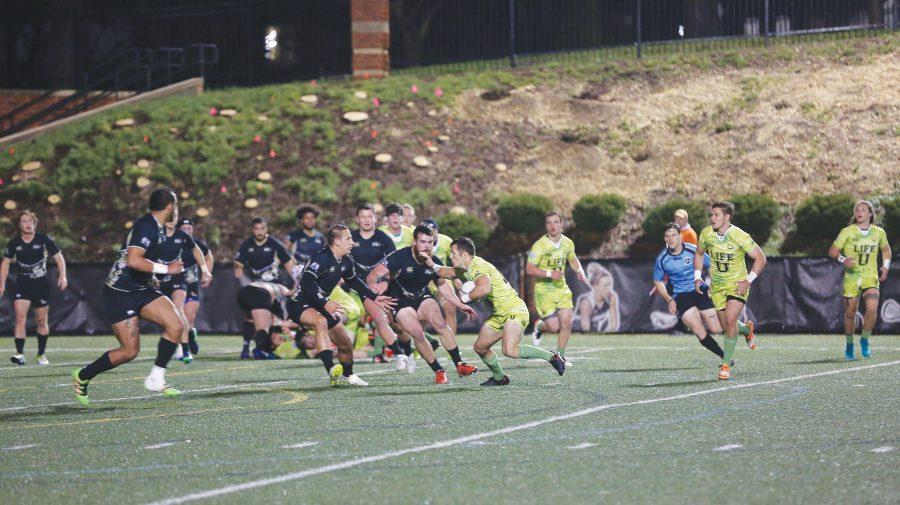 Lindenwood men’s rugby players defend opponents from Life University during the Glenn Markway Memorial game. Photo by Carly Fristoe