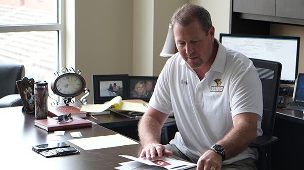 Stugart does some offseason work in his office located in the Student Athlete Academic Success Center.<br>Photo by Nao Enomoto