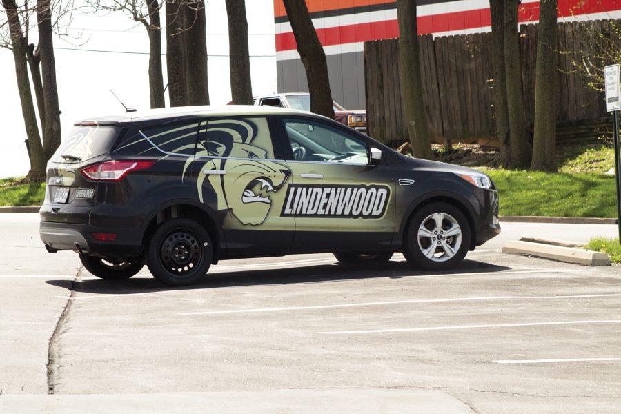One of the Lindenwood admissions cars with a doughnut tire in the Welcome Center parking lot.  Photo by Kelby Lorenz