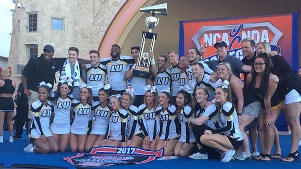 The Lindenwood large co-ed team poses with the national championship trophy.  Photo taken from Lindenwood Cheers Twitter account.