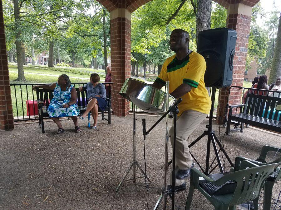 Nigel Thomas, musician of Steel Drum Flavor, plays the steel drum at Multicultural Monday on Aug. 28. Photo by Kayla Drake.