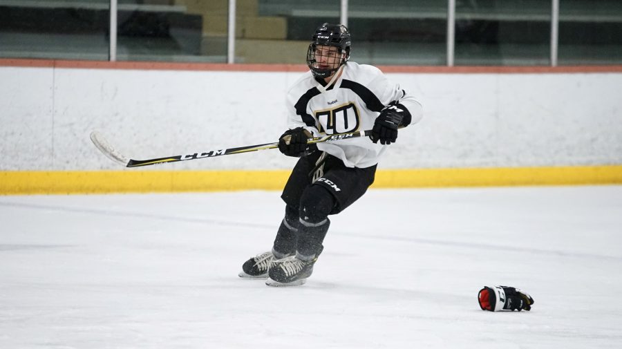 Mens ice hockey defender Austin Wilk at practice the day before this weekends games.  Photo by Mitch Kraus