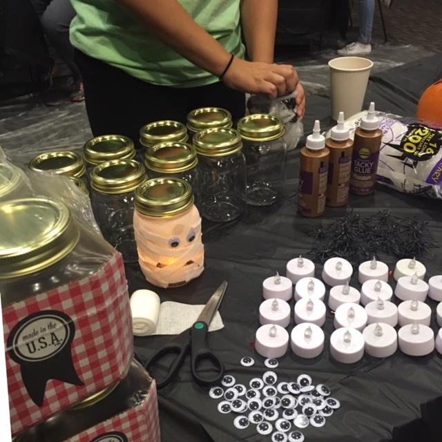 This mummy lantern-making station was popular at CABs Something Spooky event in Spellmann Center Friday night.  Photo by Wesley Thomas