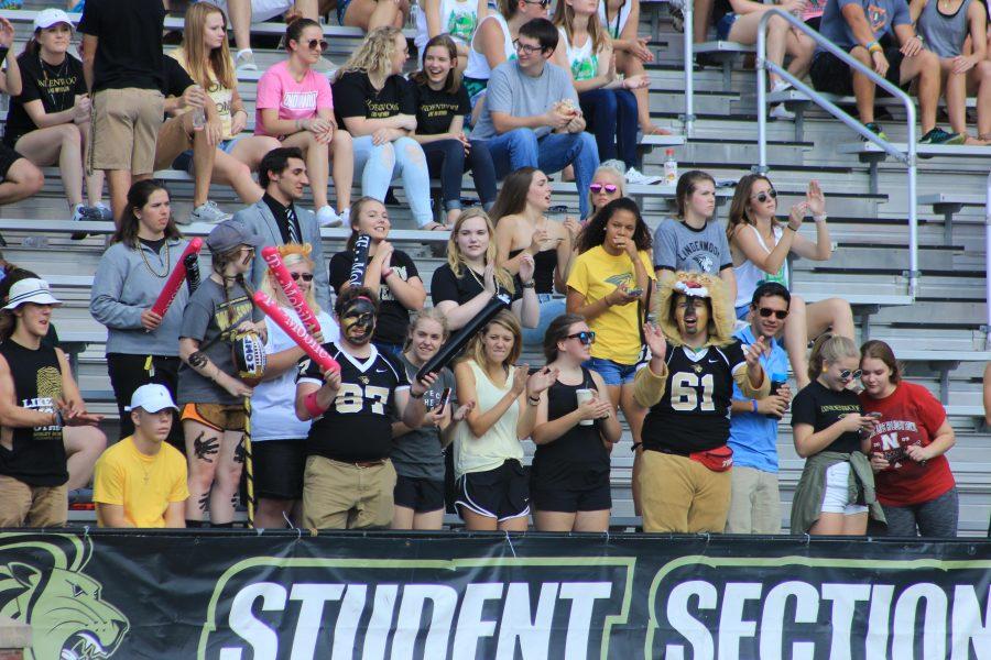 Lion Pride members cheer at the Homecoming football game in 2017. Photo by Lindsey Fiala