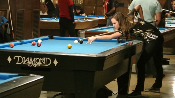 Freshman Taylor Hansen midway through a mid Sunday match in the University of Michigan Team Pool Championship. An event that she and Briana Miller made history by winning.
Photo by Alan Oliver