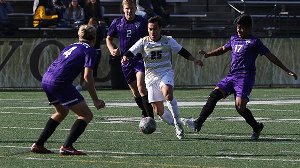 Lions midfielder Theygor Alho, No. 25, dribbles past three Bearcats players: No. 4 Logan Santo, No. 2 Alek Santo and No. 17 Angel Torres in the Lions 5-0 win against Southwest Baptist University on Friday.

Photo by Kyle Rhine