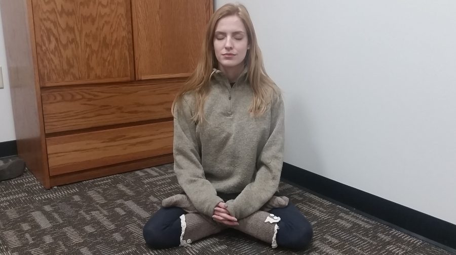 Senior+Jessie+Basler+meditates+during+the+weekly+Meditation+Association+meeting+at+6+p.m.+every+Monday+in+Spellmanns+bottom+floor.++Photo+by+Lindsey+Fiala