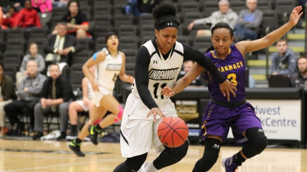Sara Ross, No. 11, dribbles past Eledria Franklin, No. 3, in Lindenwoods 82-41 win against St. Louis College of Pharmacy Monday afternoon.

Photo by Walker Van Wey