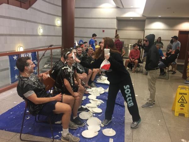 Phi Delta Theta members are pied by students at their annual Pie a Phi event in the Spellmann Cafeteria on Nov. 29.Photo by Ciara Griffin.