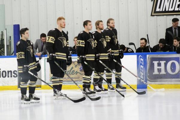 Seniors Mike Lozano, Alexander Carlsson, Graham Zagrodney, Mitch Riese, and Brett Bauza line up to start off the game on senior night. The Lions went on to win the game 3-0 on Jan. 20. File photo by Kayla Bakker. 