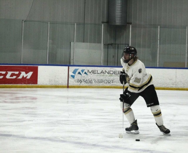 Senior defenseman Brett Bauza looks to pass the puck against the Missouri State Ice Bears at the Wentzville Ice Arena. Bauza will be one of six seniors honored before Saturday's game. <br> File photo by Kayla Bakker. 