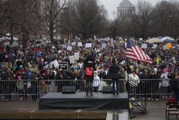 Morgan Lowe, an organizer for the St. Louis March for Our Lives, speaks to the gathered crowd at the kickoff of the event. There were an estimated 10,000 to 15,000 people participating, according to an announcement.  Photo by Mitchell Kraus