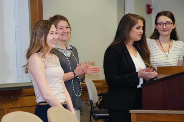 From left: Abby Russell, Julia Thorne, Krystia Grembocki and Mariah Palmer present during the Psi Chi induction March 3. All four are Psi Chi officers, Grembocki being the Psi Chi president.  Photo by  Christopher Scribner
