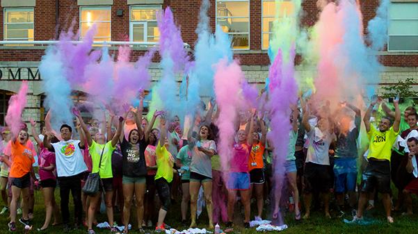 Students toss powder paint into the air after participating in the Campus Activities Board Fall 2016 color run. CAB is hosting its annual color run this upcoming Saturday, April 27.
 File photo by Kelby Lorenz.