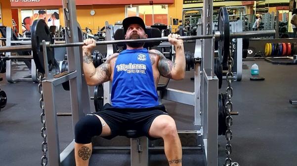 Patrick Longo shoulder presses 135 pounds at Gold’s Gym St. Peters.  Photo by Lauren Grayek