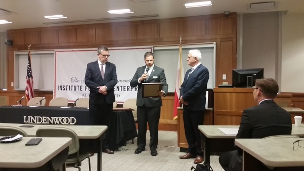 Ambassador Piotr Wilczek (left) and Dr. Wojciech Golik (right) accept their certificates of recognition from State Rep. Kurt Bahr. <br> Photo by Lindsey Fiala