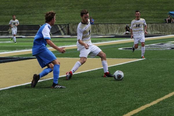 Lindenwood+defender+Gaspar+Alvarez+grapples+with+a+player+from+Rockhurst+in+Hunter+Stadium+Tuesday.+++Photo+by+Maria+Escalona