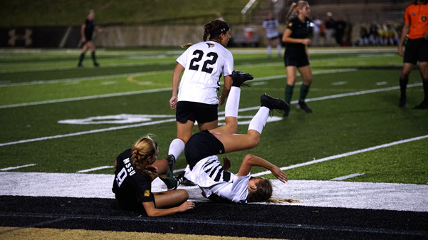 Lions midfielder Bailey Bologna falls over Missouri Southern States Alex McCord during the second half.  Photo by Mitchell Kraus
