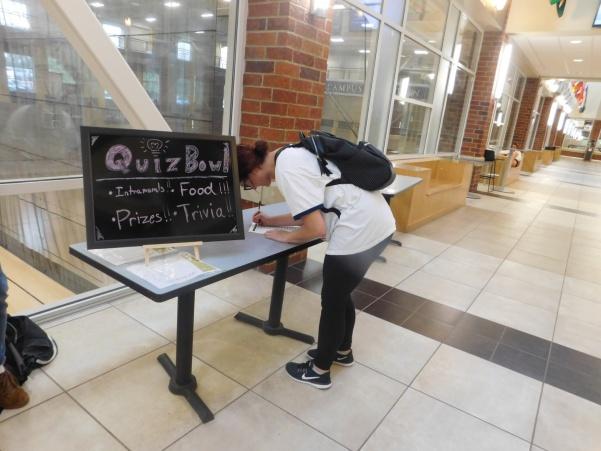 A student signs up for the Lindenwood Quiz Bowl, a new club coming to campus. Photo by Marquita Young. 