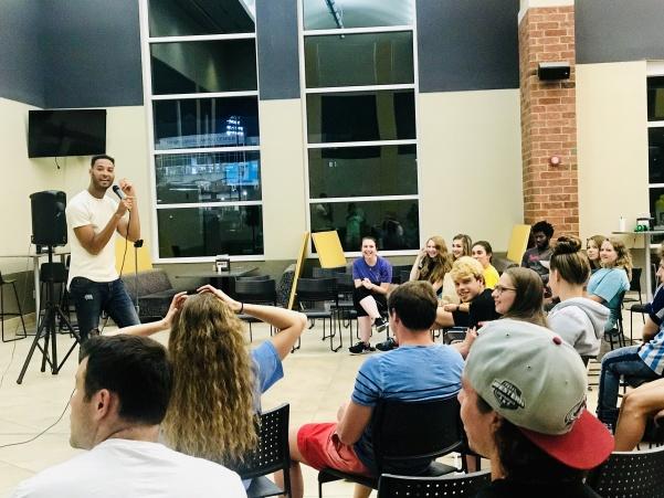 Lindenwold students join in laughter at comedian, LeClerc Andres stand up show in Evans Commons dining hall.  Photo by Lauren Pennock  