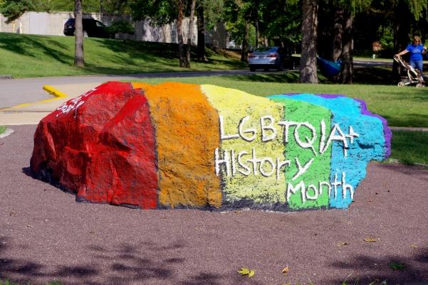 The Lion Pride rock painted by Genders/Sexualities Alliance in 2018.