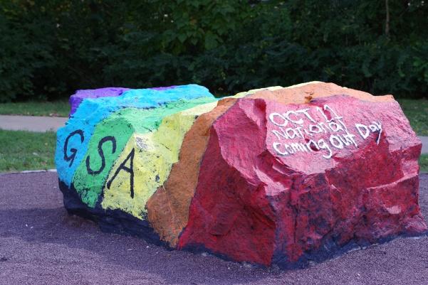 The Genders/Sexualities Alliance said they had just finished painting the Spirit Rock when a man drove by and yelled a homophobic slur at them. 