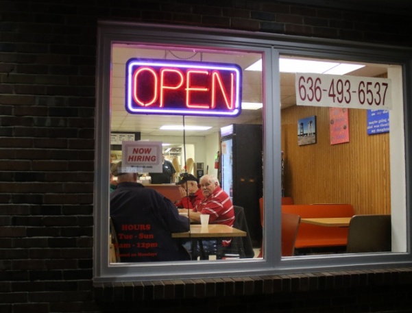 A 5 a.m. regular since 1973, Frank Childress looks out the window. Donut King reopened in March 2018. 
Photo by Kayla Drake