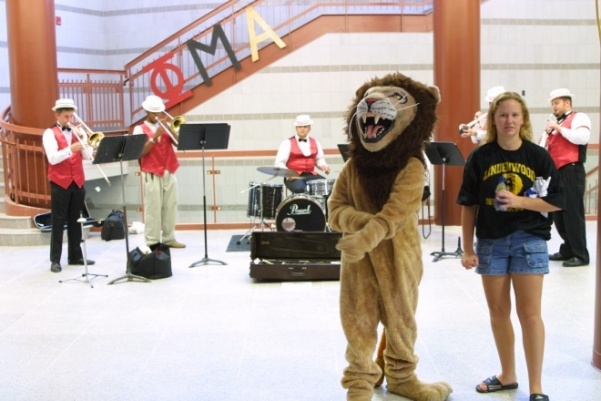 Leo the Lion at the grand opening of the Spellmann center, one of the nine buildings constructed on campus during the Dennis Spellmann administration.   Photo from the Mary Ambler Archives.
