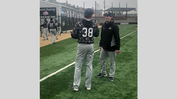 Assistant coach Zac Pearman, right, speaks with Lindenwood pitcher Brody Roach. Pearman graduated from Lindenwood in 2014. 