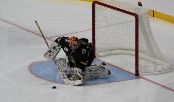Goalie Sophie Wolf from Ontario blocks a shot during the game opener of the season against the University of Wisconsin on Friday night at the Centene Ice Community Arena. 