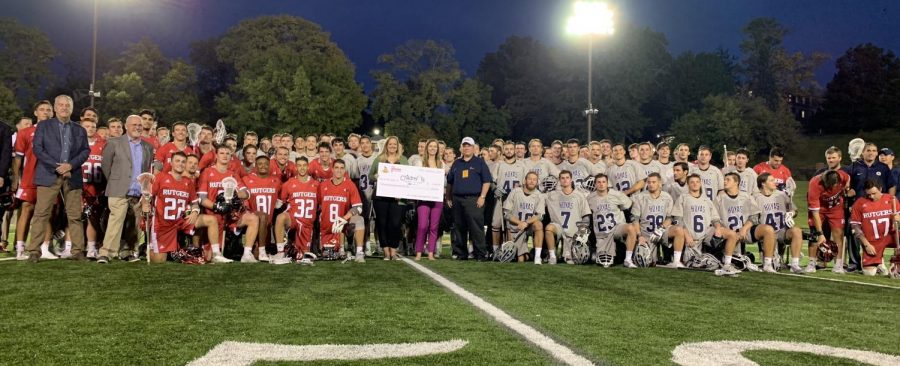 Georgetown University and  Rutgers University pose with the check that was given to Childrens Hospital. Photo provided by William Stark. 
