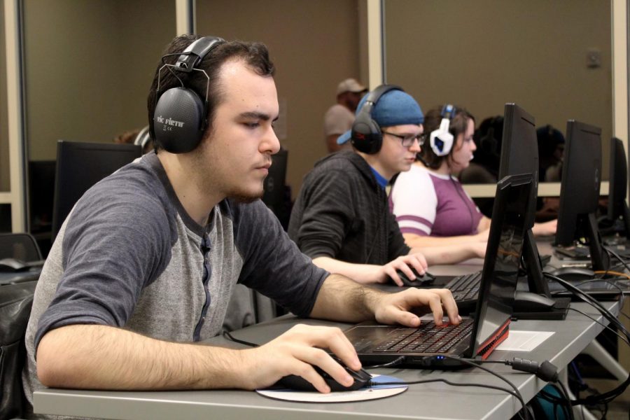 Overwatch players Joshua Coone, Sean Greenwood and Amanda Krsul work together to defeat their opponents from Florida Tech College. Greenwood serves as the in-game lead and analyst on the Overwatch team. 