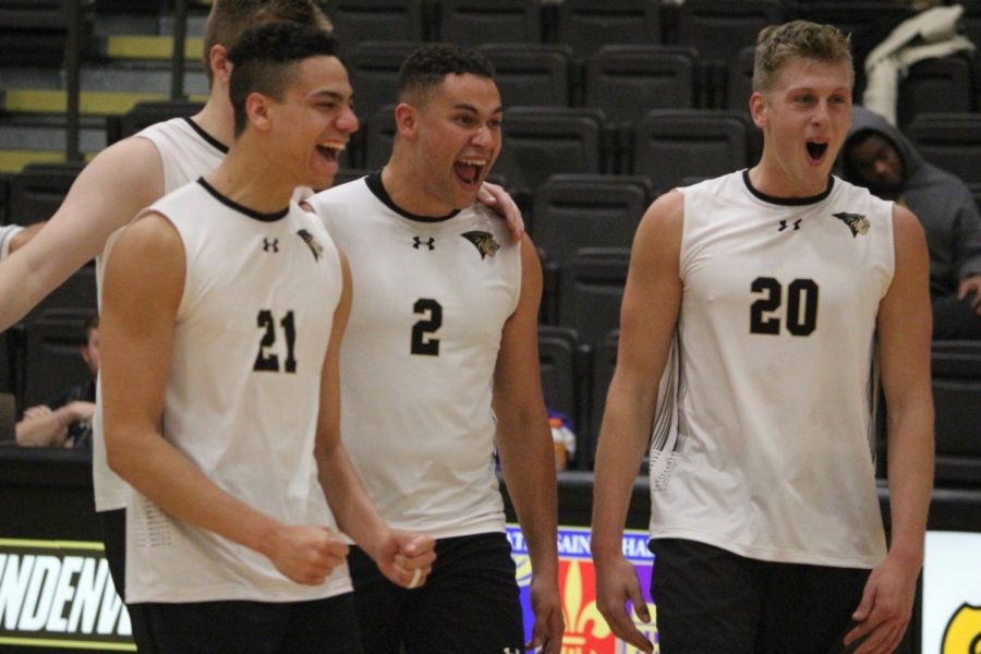 Mens+volleyball+players+%28from+left%29+A.J.+Lewis%2C+Elijah+Tabuarua%2C+and+Michael+Jennings+celebrate+victory+over+Saint+Francis+on+Jan.+17%2C+2020