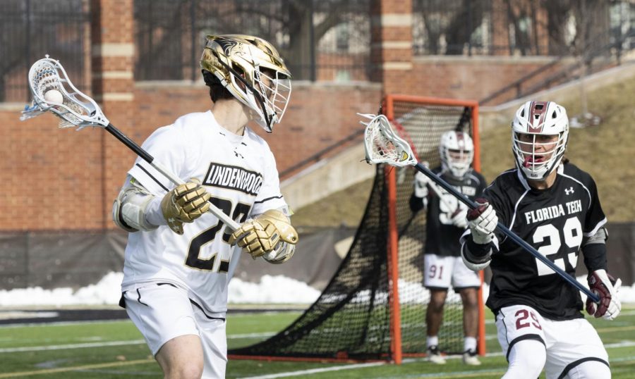 Attacker+Peter+Covington+%28No.+29%29+tries+to+make+space+to+shoot+against+Florida+Tech+defender+Nick+Fornadel+on+Feb.+9%2C+2020.+Covington+scored+four+goals+in+the+game.++