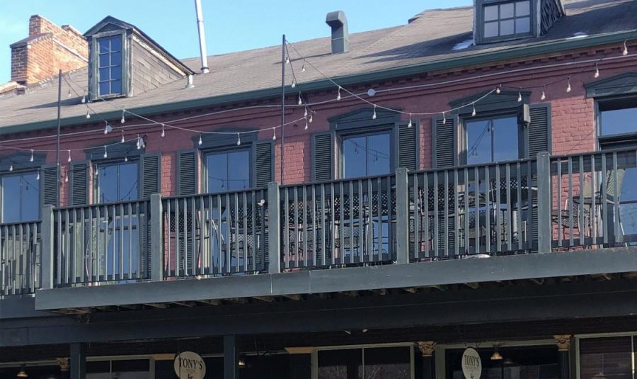 The hanging lights above the balcony of Tonys on Main Street were the subject of a recent hearing. The Landmarks Board ruled they were not allowed in a historic district, but the restaurants owner argued the city made the decision because of personal animosity against him.  