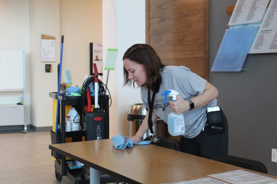 Lindenwood custodian Jennifer Swanson works to sanitize the Library and Academic Resources Center over spring break to fight the coronavirus.  