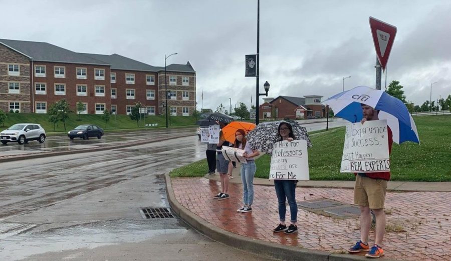 Students and alumni gathered outside of the LARC entrance on May 27 to protest the layoffs of staff and faculty.  Photo courtesy of Trisha Tamblyn. 